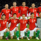 Pictured: ten guys who would clean up if they wore their kits out to the club, and Gábor Király. Photo via AP